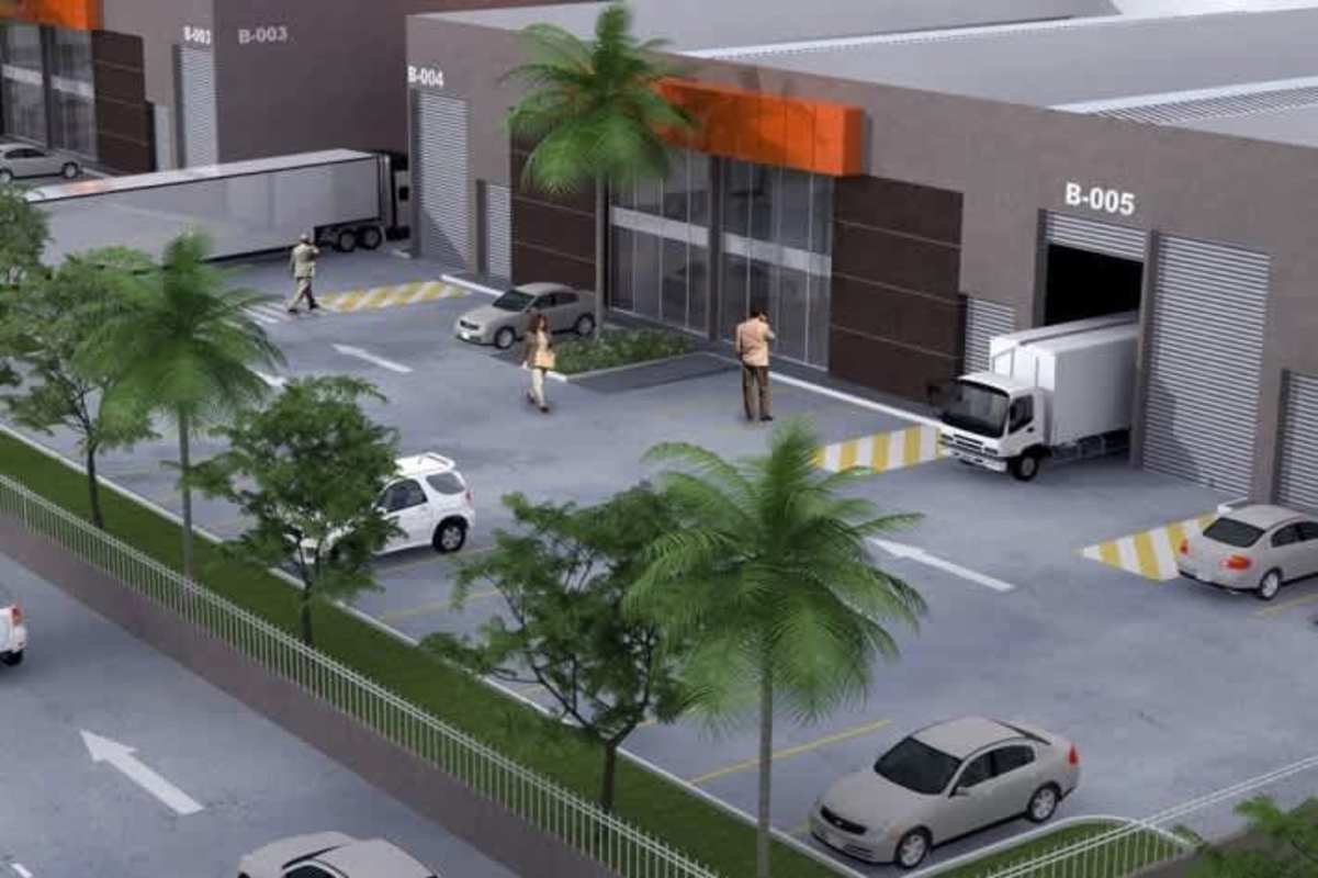Street-level view modern industrial warehouse complex with truck bays and palm trees Panama