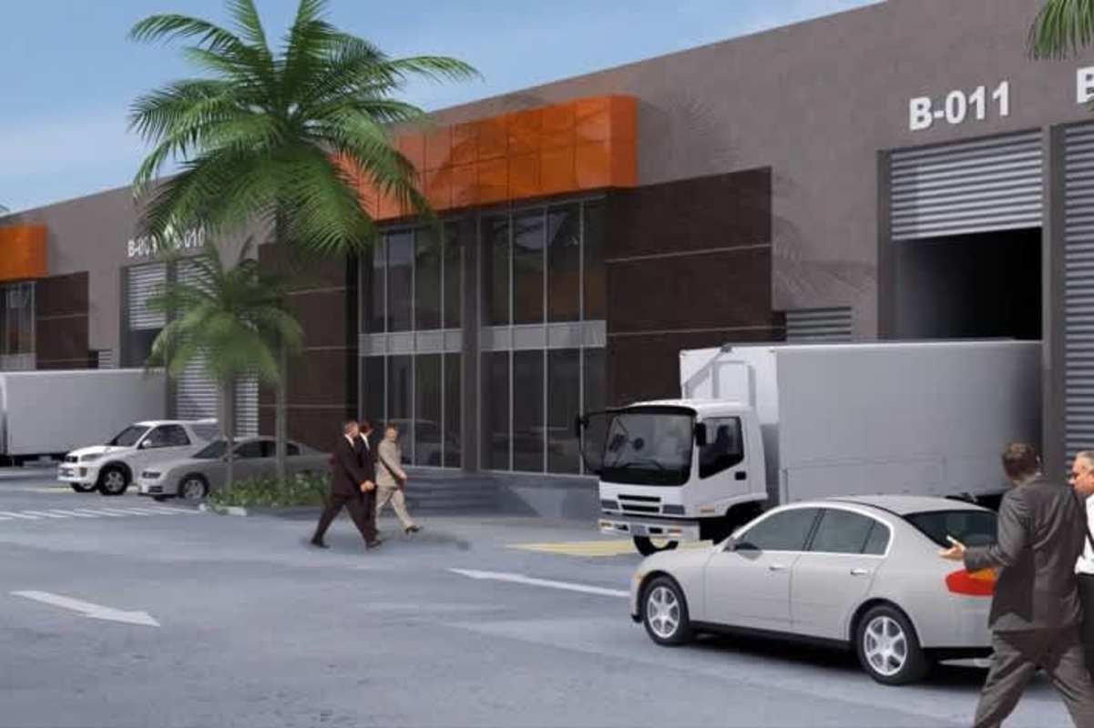 Large warehouse units with parking truck access and palm trees in Parque Industrial Panama
