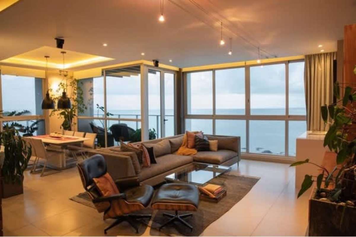 Modern living and dining area with panoramic Pacific view, luxury condo in PH Oceanaire Punta Pacifica Panama City