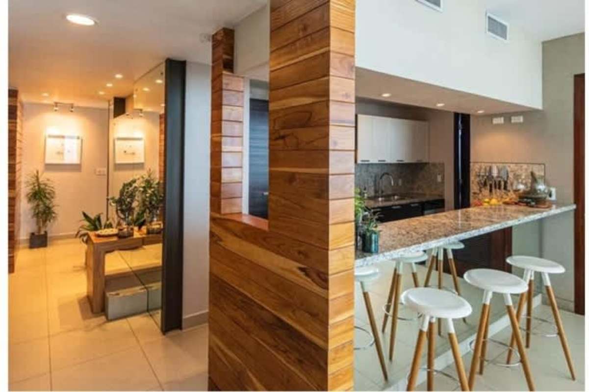 Stylish kitchen with granite countertops and wooden accents PH Oceanaire condo for sale