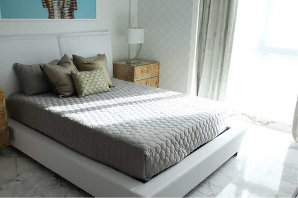 Modern bedroom with city view window in PH Regalia Costa del Este