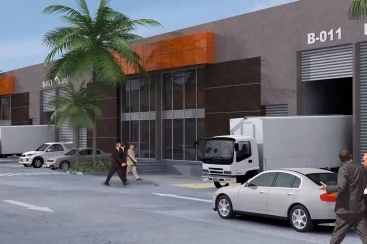 Modern warehouse complex exterior with truck loading bays, glass facade, and parking at Parque Industrial Las Americas Panama City