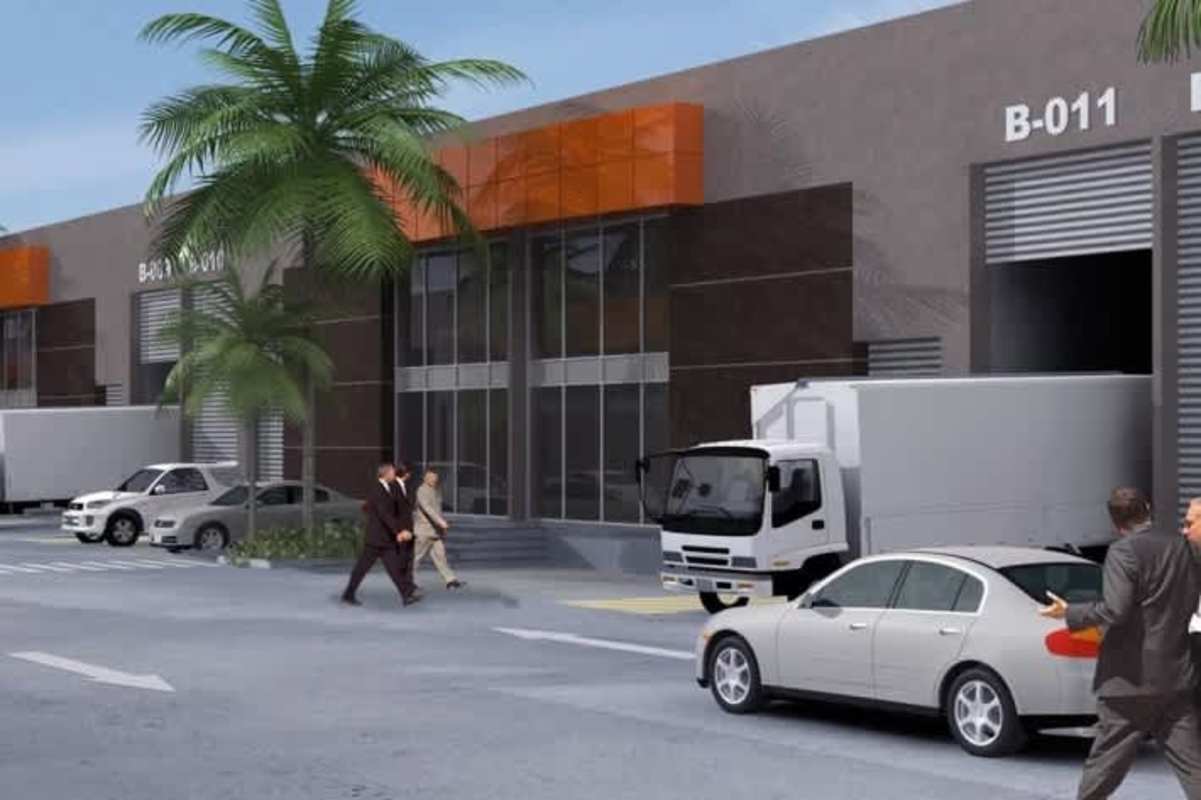 Contemporary industrial warehouse with trucks, parking and facade in La 24 de Diciembre Panama City