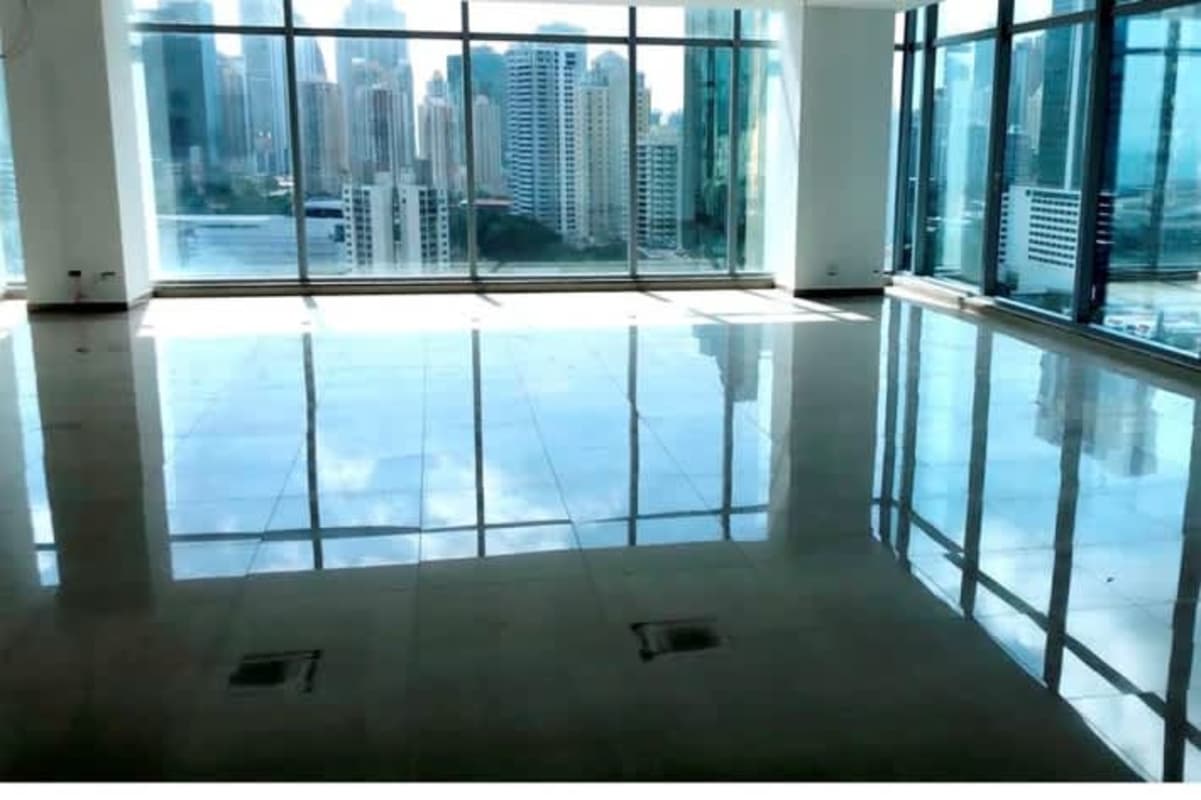Spacious commercial office with panoramic city views through glass windows in PH Panama Business Tower Obarrio