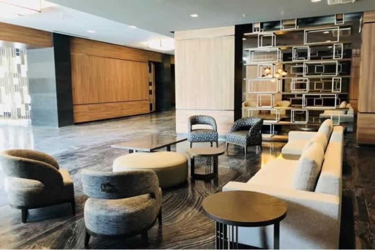Stylish business lobby with beige sofas, marble flooring, geometric design Obarrio Panama
