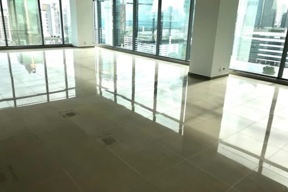 Empty open-plan office floor with floor-to-ceiling windows overlooking Panama City skyline in Obarrio