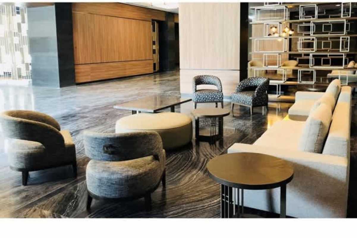 Spacious lobby area with marble flooring and lounge furniture in Obarrio Panama City