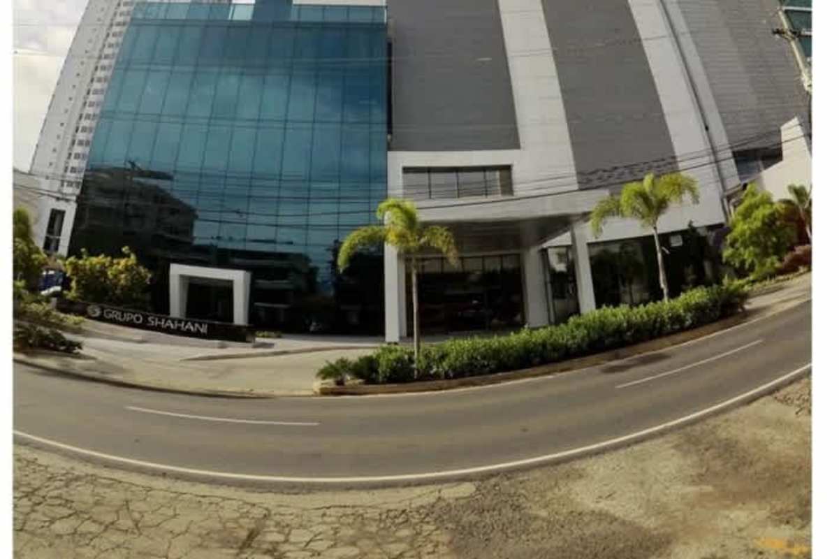 Panoramic city skyline seen from office interior at Panama Business Tower Obarrio Panama City