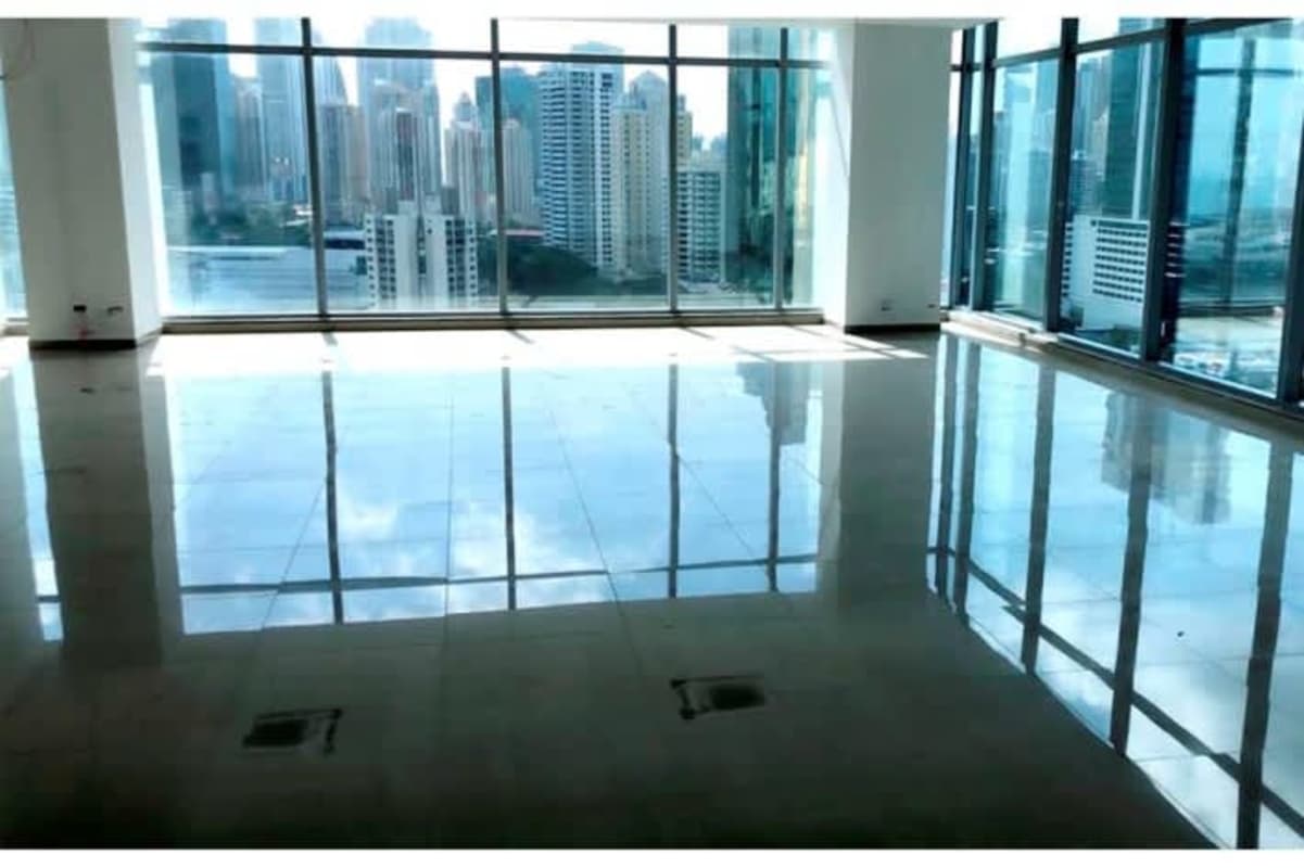 Contemporary lobby with armchairs, sofas, and marble flooring PH Panama Business Tower Obarrio Panama