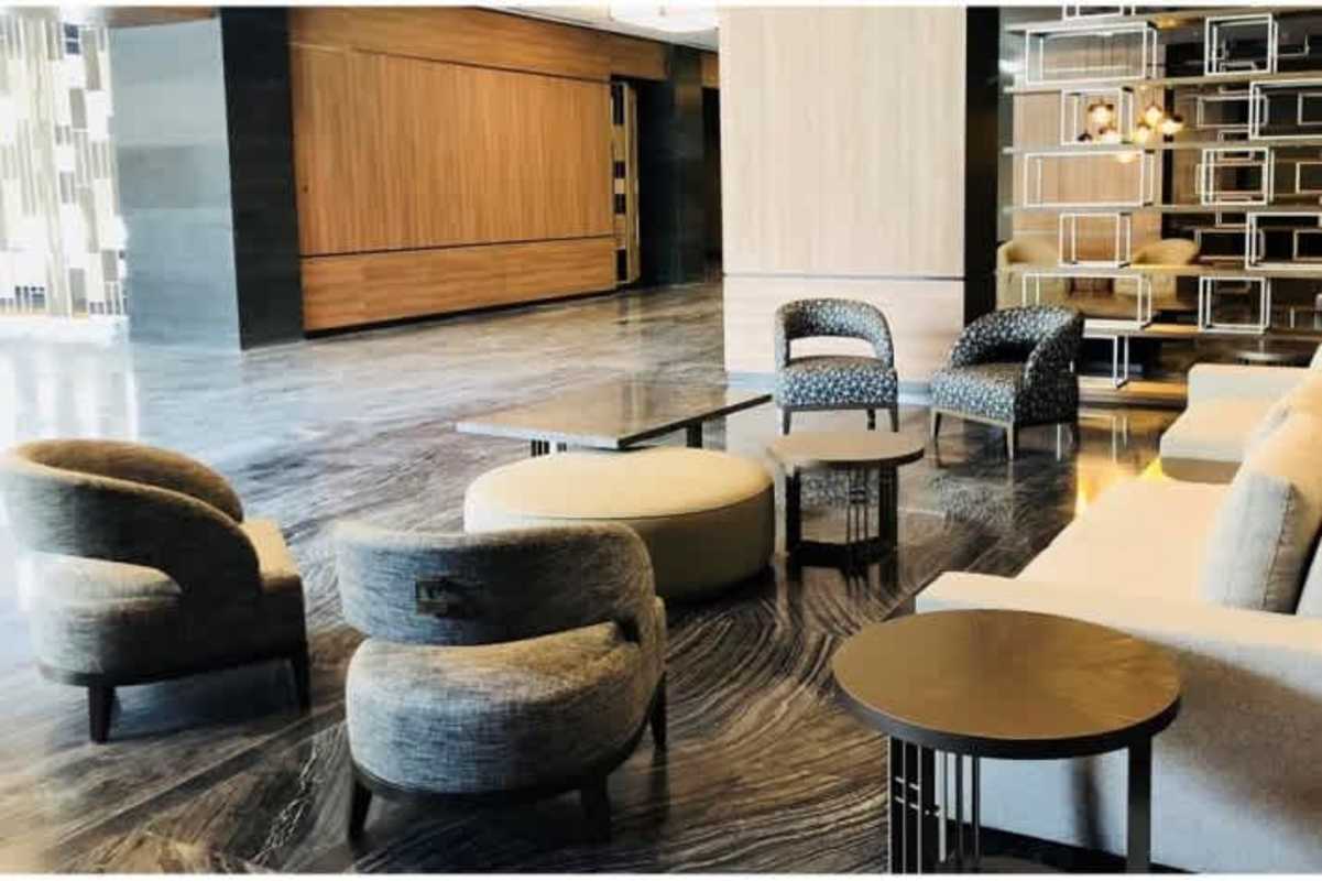 Elegant lobby entrance with marble floors and designer furniture at PH Panama Business Tower Obarrio