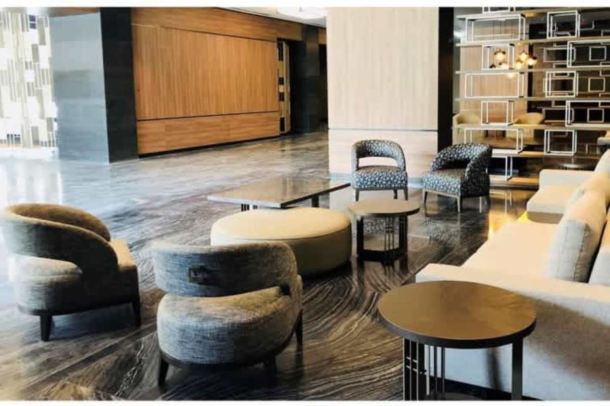 Spacious interior with floor-to-ceiling windows and skyline view in PH Panama Business Tower