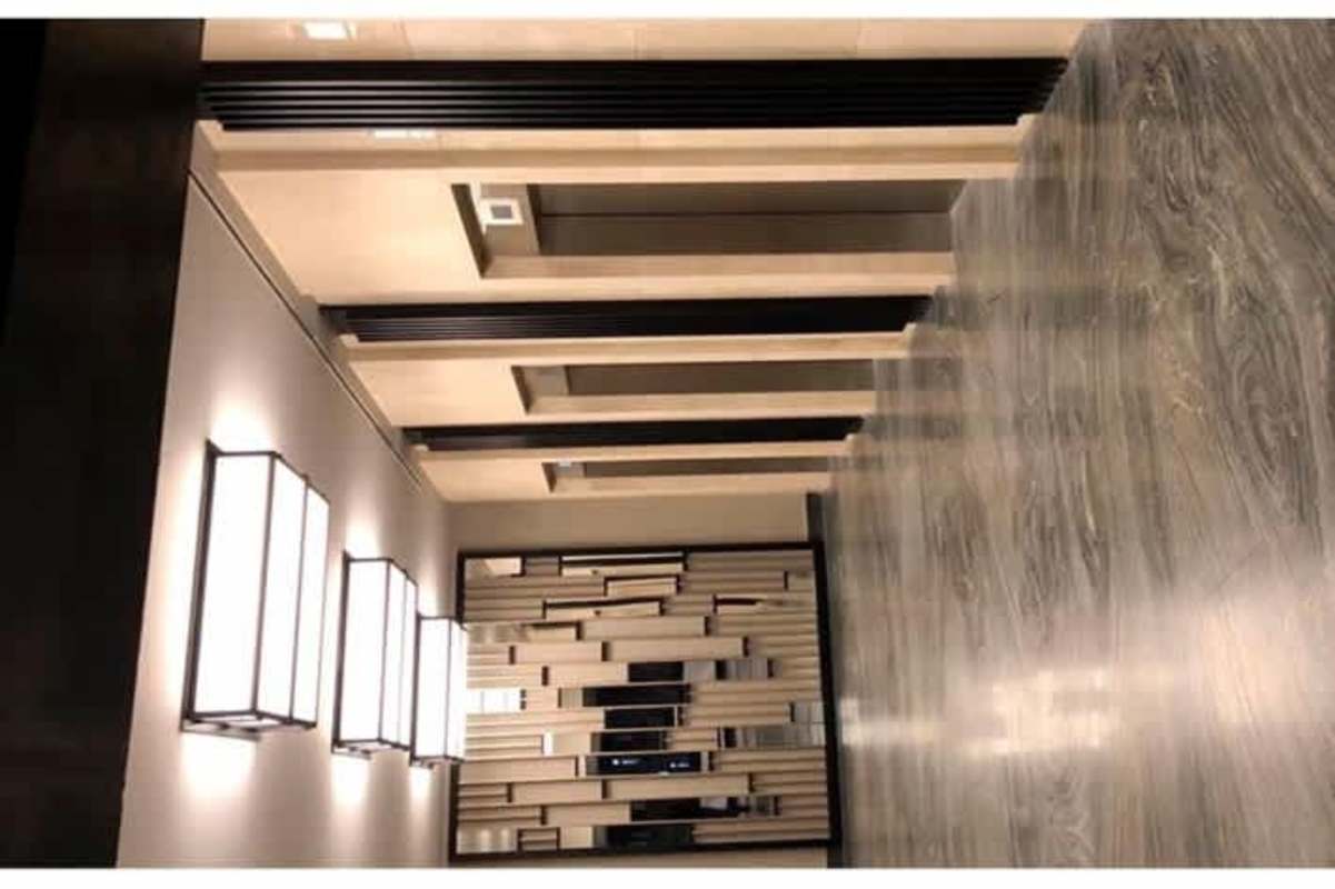 Chic lobby with decorative accents, armchairs, marble floors in Panama Business Tower Obarrio