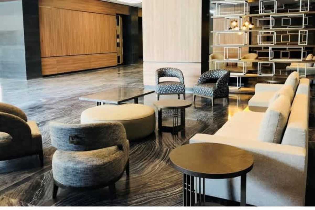 Modern lobby lounge with designer furniture and marble flooring in Panama Business Tower Obarrio
