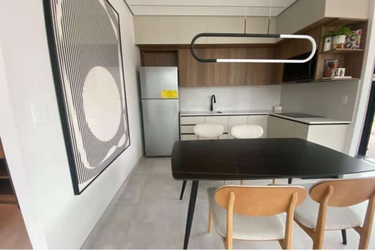 Compact open-plan kitchen dining area with light cabinetry in Costa del Este Panama