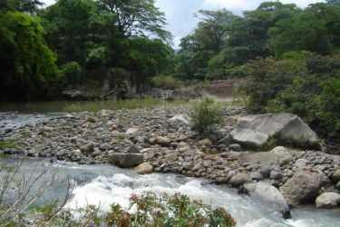 Rocky scenic river along lush mountain terrain panoramic countryside land Chame Panama
