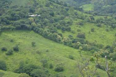 Aerial panorama of hilly farmland and forests ideal for ranch or development in Chame Panama
