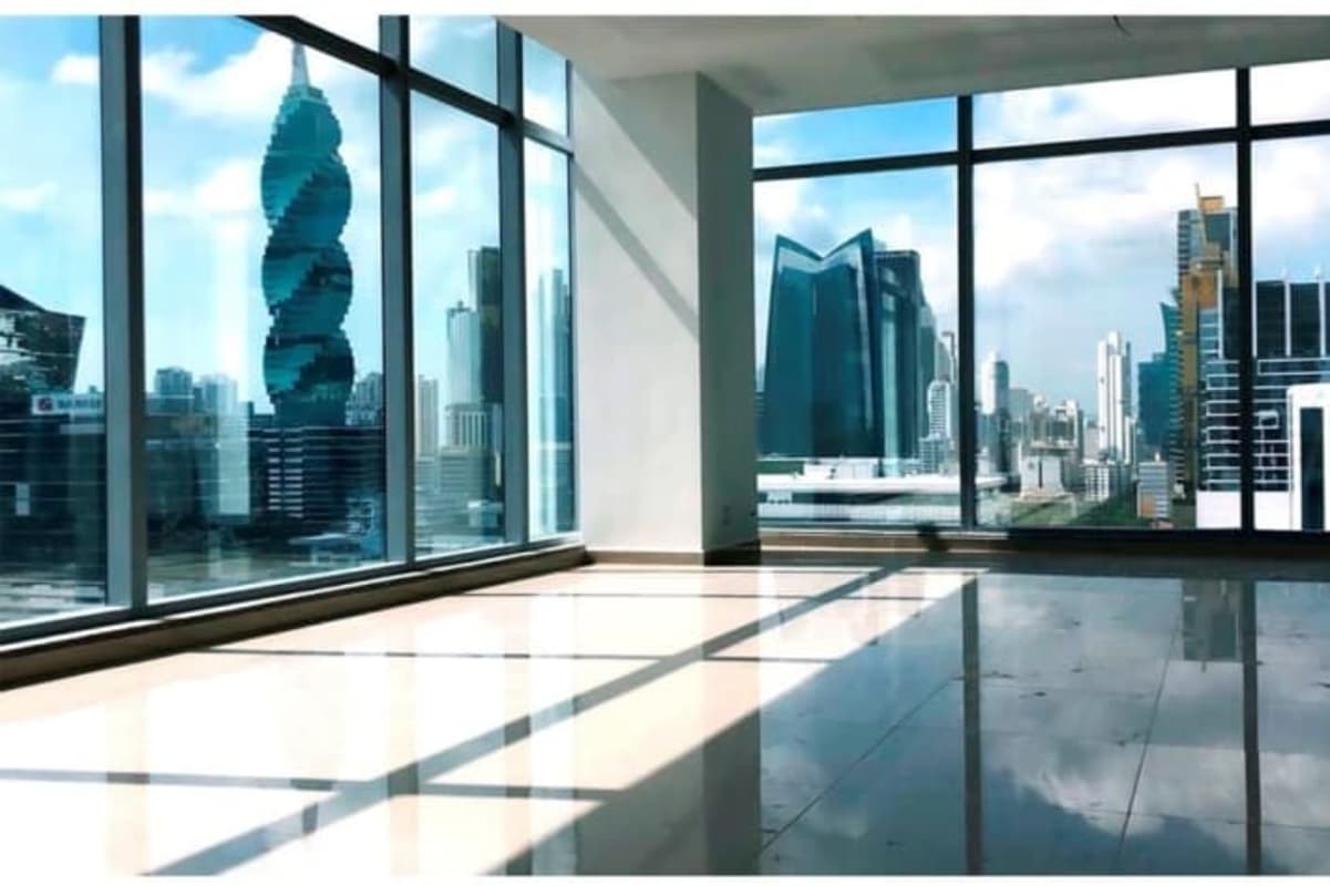 Modern open office with floor-to-ceiling windows and city view Panama Business Tower Obarrio Panama City