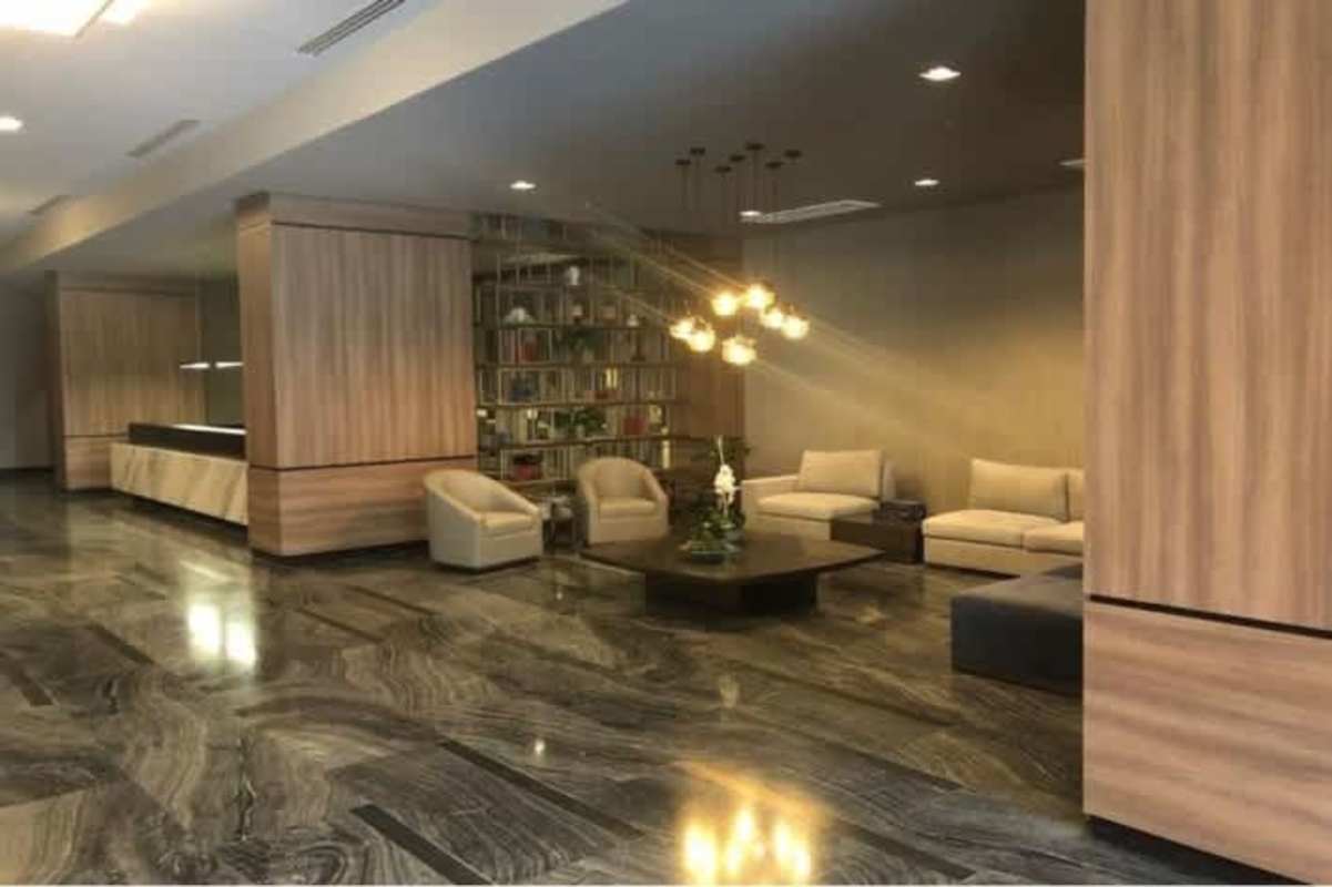 Contemporary lobby with marble flooring, wood accents in PH Panama Business Tower Obarrio Panama