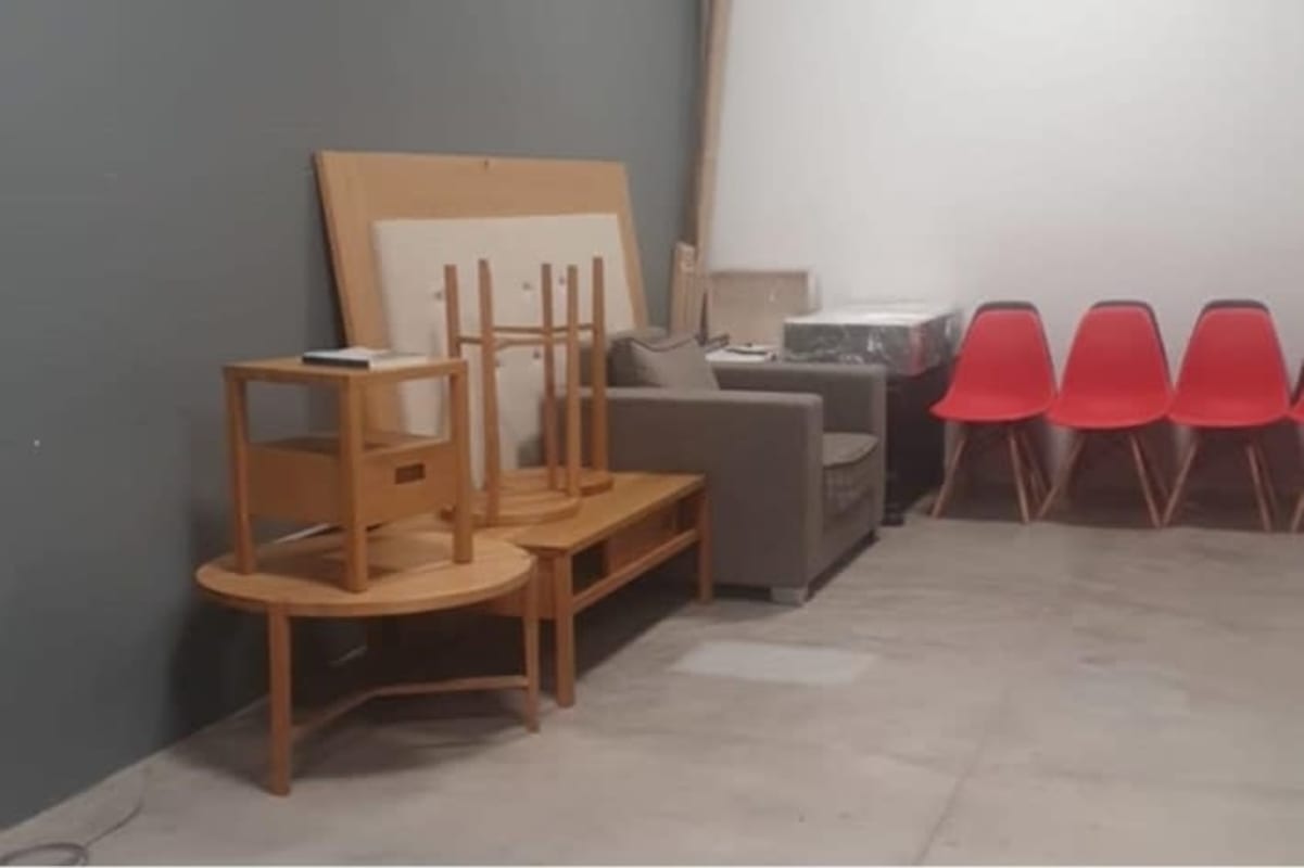 Interior commercial corridor with staircase, exposed ducts, concrete floors and black-yellow decor in Obarrio Business Plaza Panama