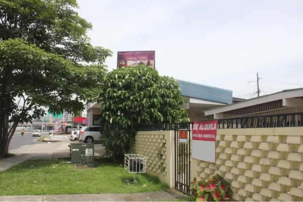 Street-facing view of one-story gated commercial house with signage Betania Panama