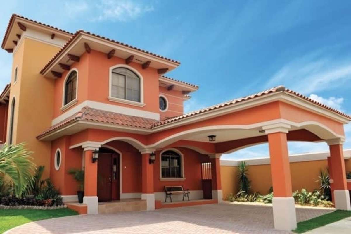 Mediterranean house with arched patio and bay windows overlooking garden, Costa Sur Panama