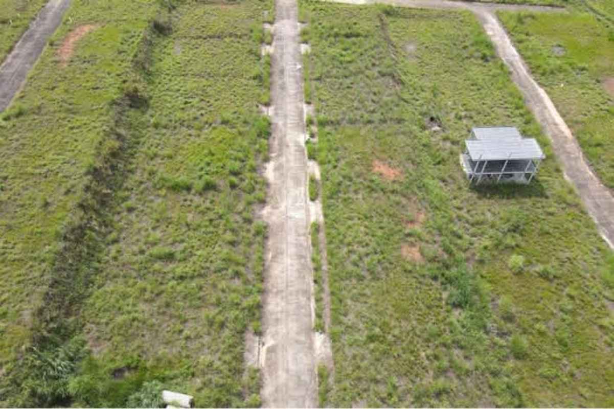 Vacant residential lots in Green Valley Pedregal with paved streets visible