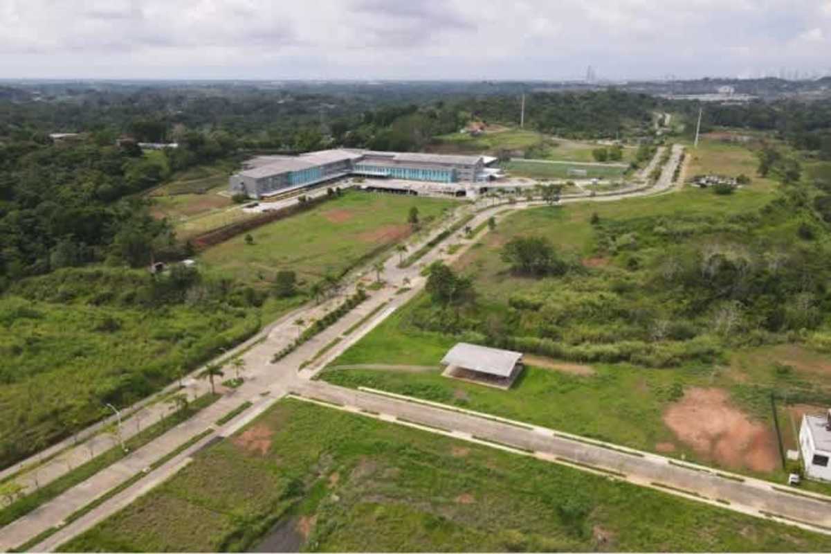 Planned residential development at Green Valley Smart City with open plots and access roads