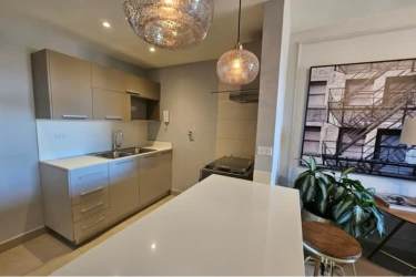 Stylish kitchen cabinetry with breakfast bar and pendant lighting Panama Pacifico