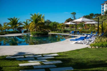 Bright living and dining area with sliding glass doors to oceanfront balcony in PH Ensenada Oceanfront San Carlos