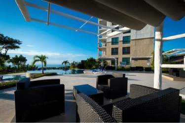 Main bedroom furnished with ocean view window in PH Ensenada Oceanfront San Carlos Panama