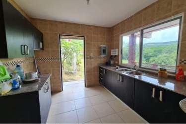Bright kitchen with granite counter, large windows with mountain view in Altos del María Panama