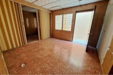 Bedroom with striped wall panel, mirrored closet and tiled floor house for sale La Chorrera Panama