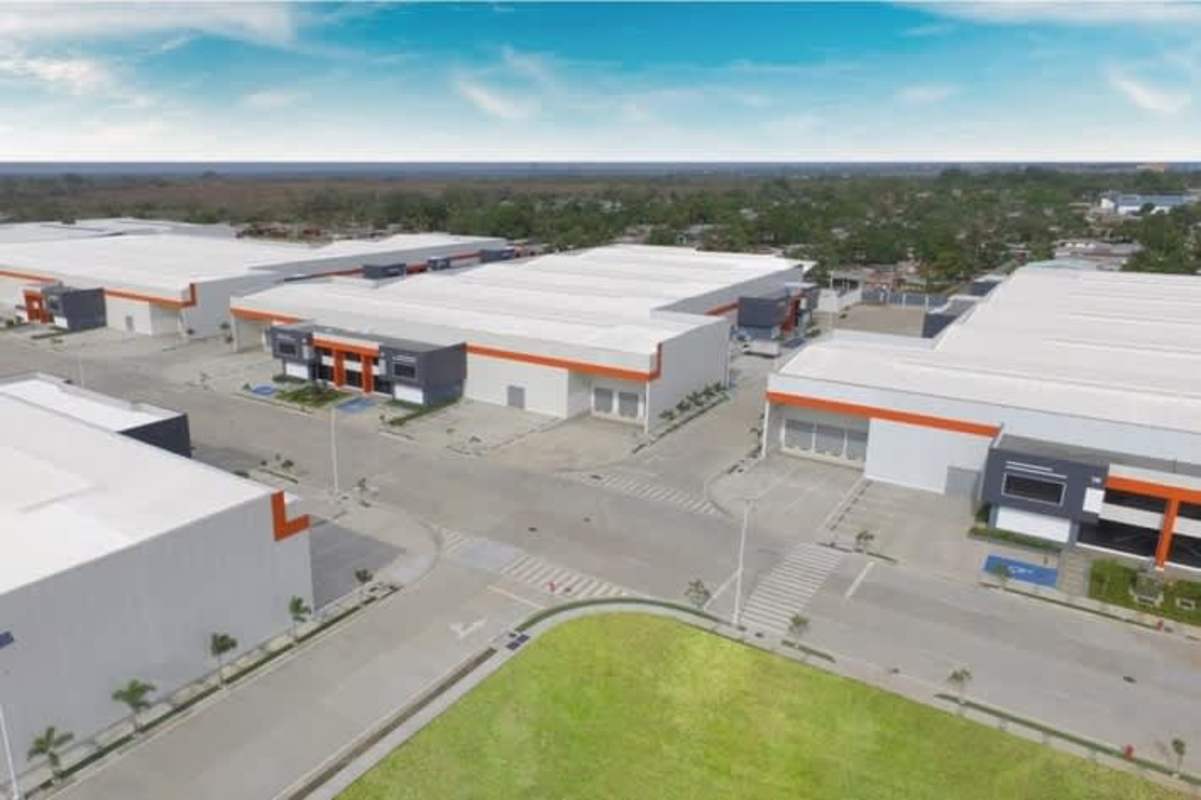 Large warehouse complex with multiple entry points and orange roof accents Panapark Free Zone Panama