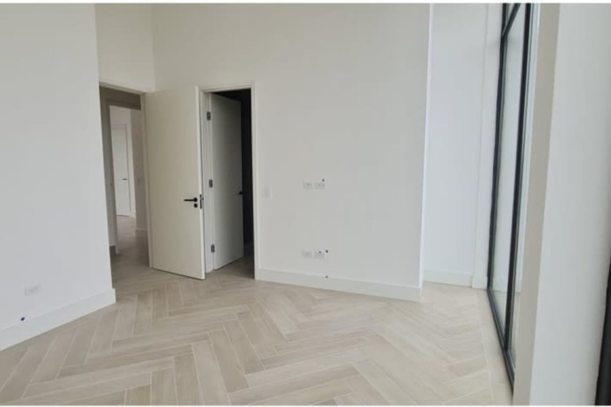 Modern bedroom with wood floor large window Ocean Villas Ocean Reef Panama