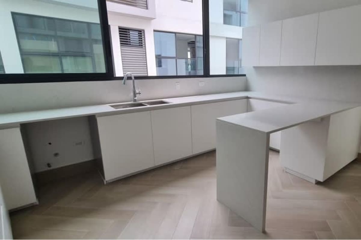Sleek kitchen with cabinetry and window Ocean Villas Ocean Reef Panama