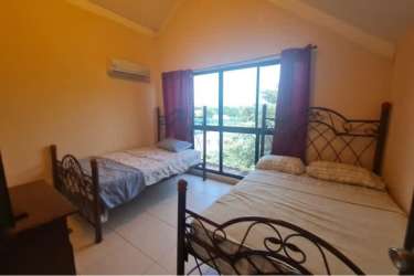 Modern open living dining area golf view PH Coronado Golf beach condo Panama