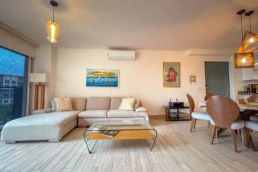 Resort-style pools surrounded by gardens and beachfront buildings at Playa Caracol, Punta Chame Panama