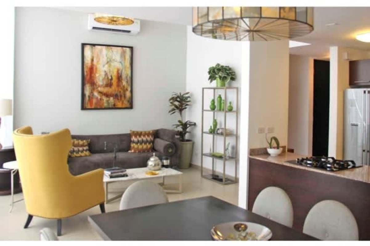 Spacious dining room with glass doors opening to garden, elegant furniture Costa Sur Village