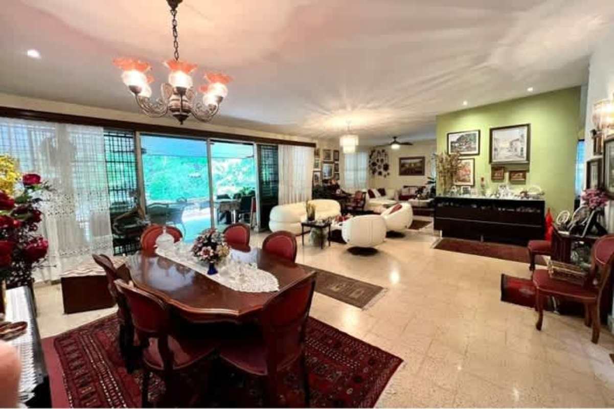 Spacious living dining room with sliding glass doors, traditional furniture in La Loma Panama
