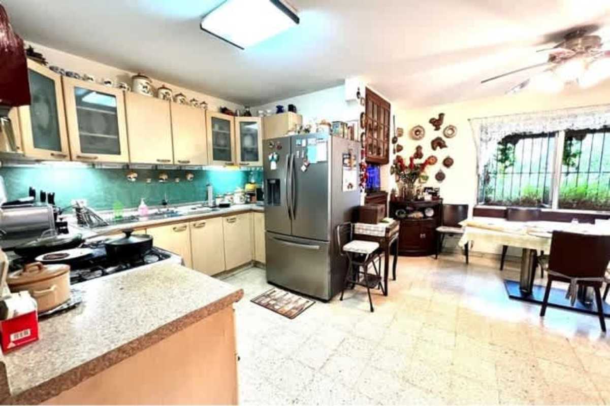 Spacious kitchen with breakfast area and appliances in Hato Pintado home Panama