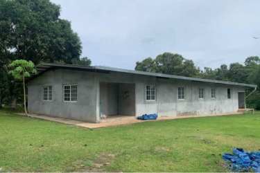Small rural houses and deposit buildings on agriculture farm Capira Panama