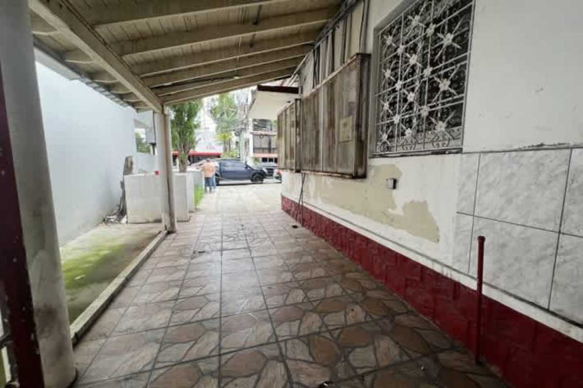 Covered carport and walkway with tile floor and exposed beams commercial sale El Cangrejo Panama City