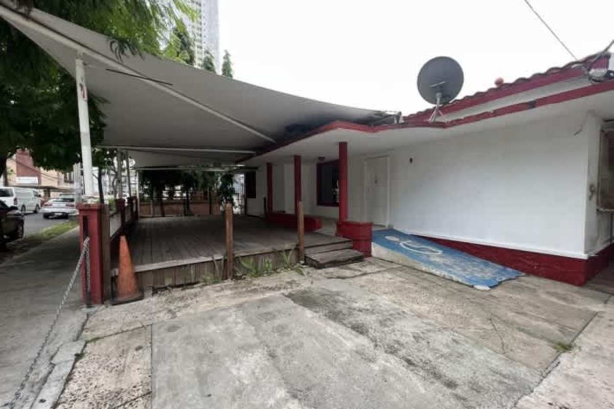 Covered carport with wheelchair ramp on corner lot commercial building in Bella Vista Panama City