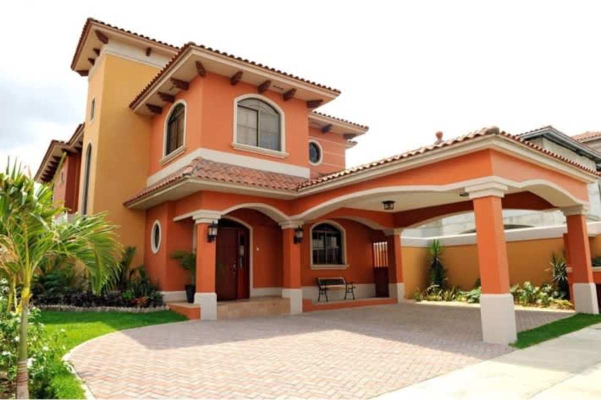 Double-height lobby and modern staircase design in Mediterranean home El Doral Costa Sur Panama