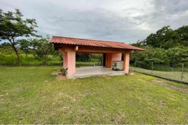 Traditional rustic outdoor bohio with tiled patio on countryside lot in Panama