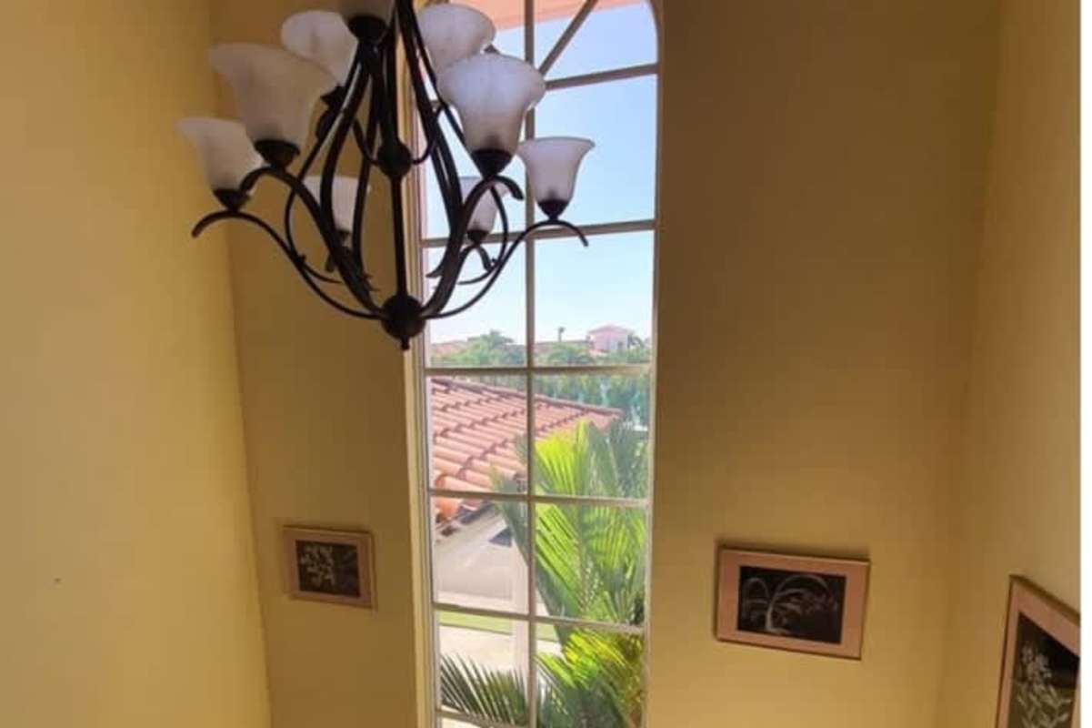 Luxury home dining room with wooden seats glass doors garden views Palmeras del Este