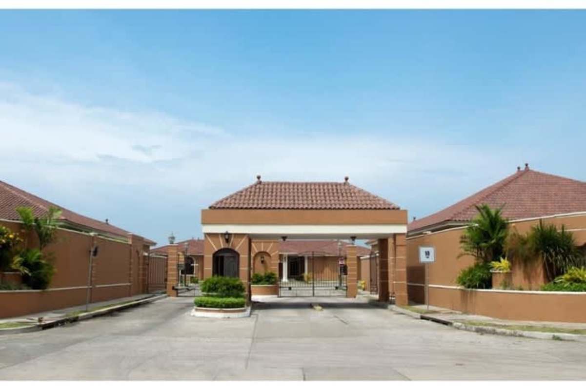 Large swimming pool with jacuzzi surrounded by palm trees in luxury gated community Sunset Coast Panama