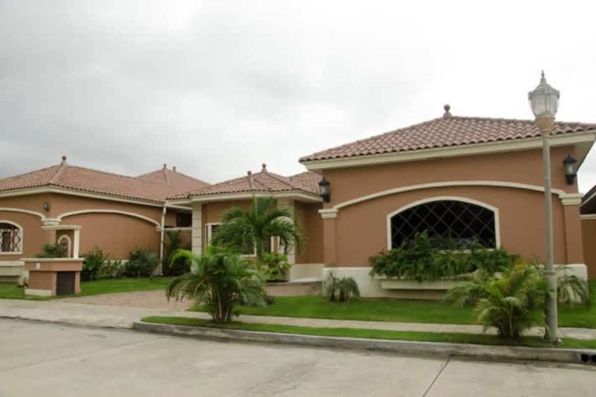 Modern kitchen with granite countertops, island, stainless appliances in Sunset Coast luxury house Panama City