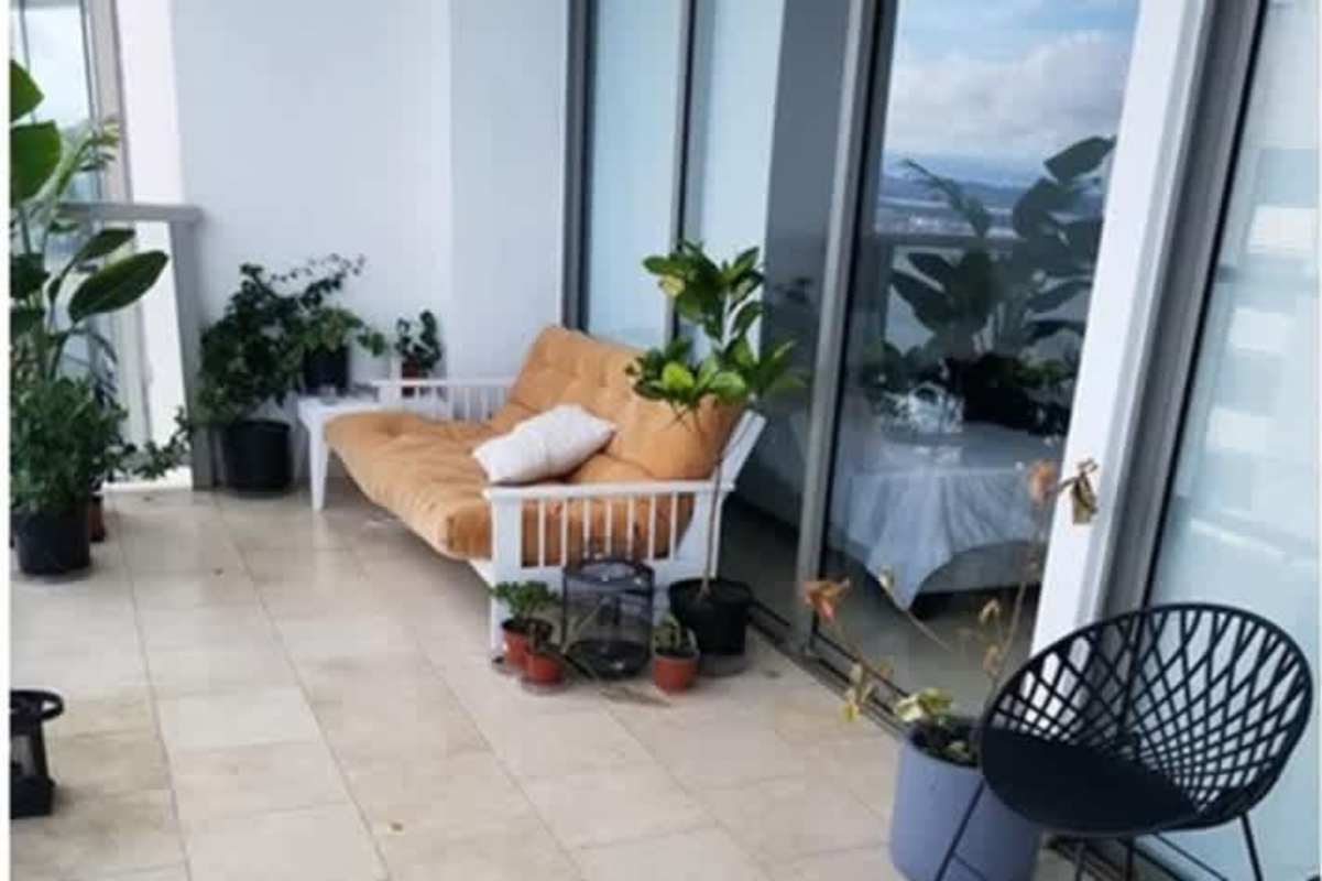 Bedroom with large window offering ocean views The Ocean Club Panama