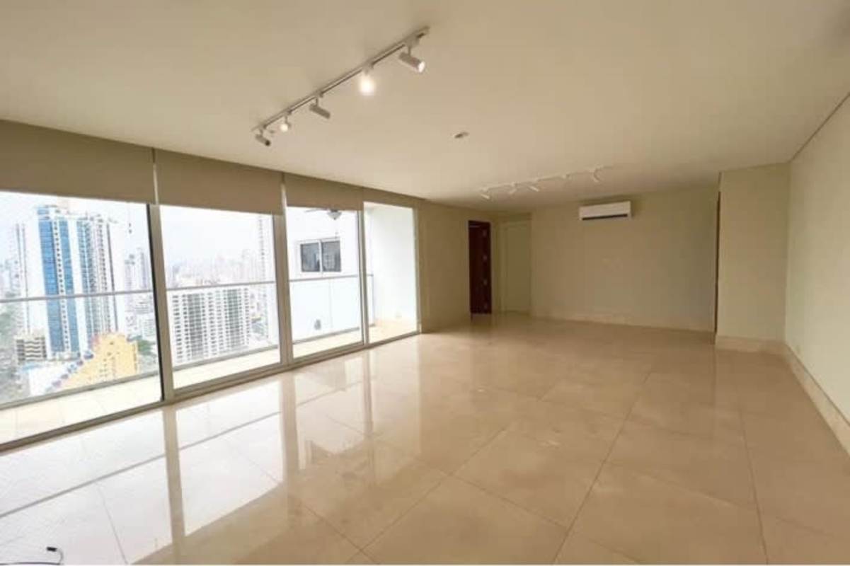 Modern balcony with safety net, glass railing, ocean and skyline views at PH Windrose Panama City